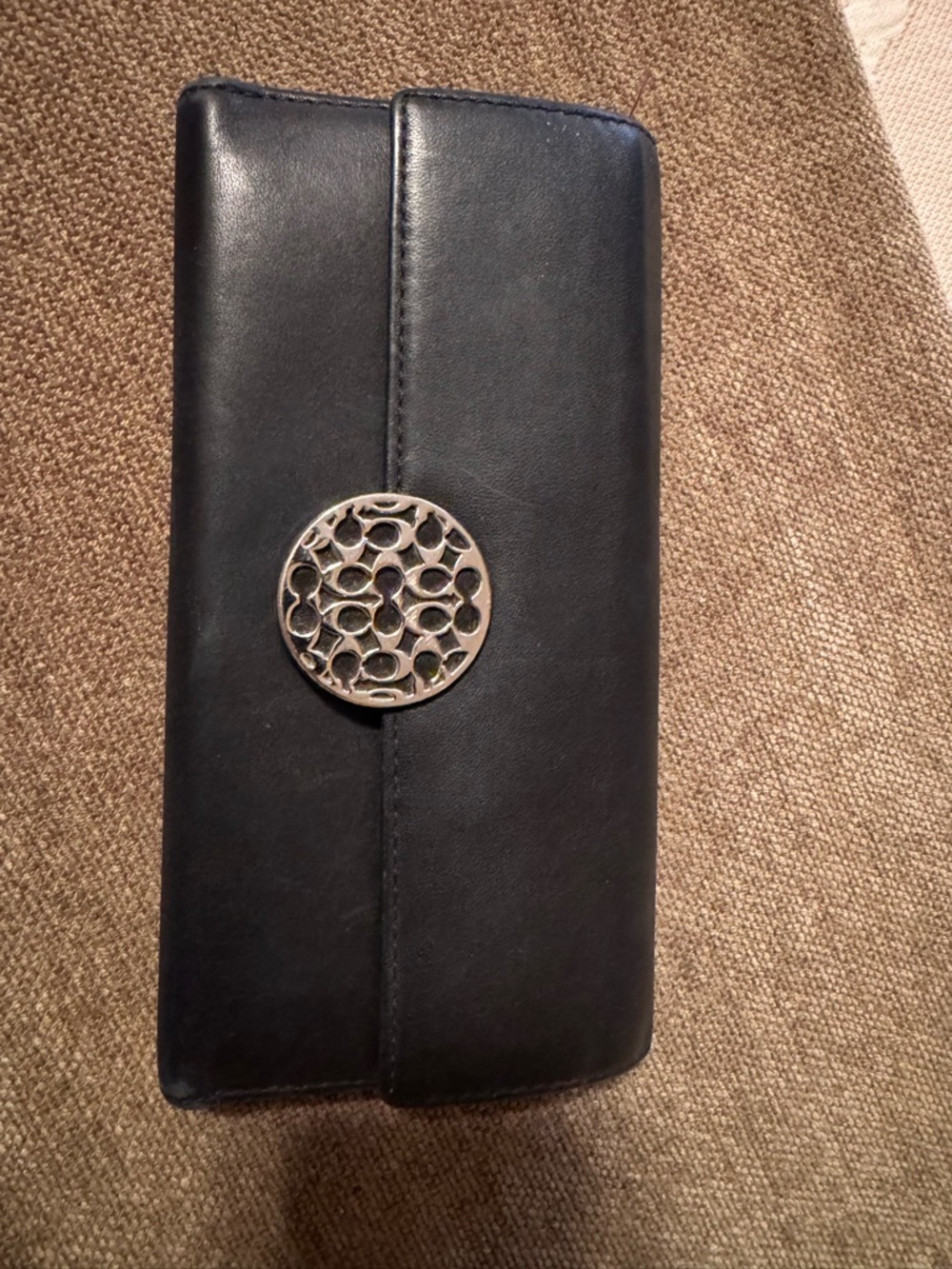 Black Leather Coach Clutch Wallet with Decorative Silver Medallion